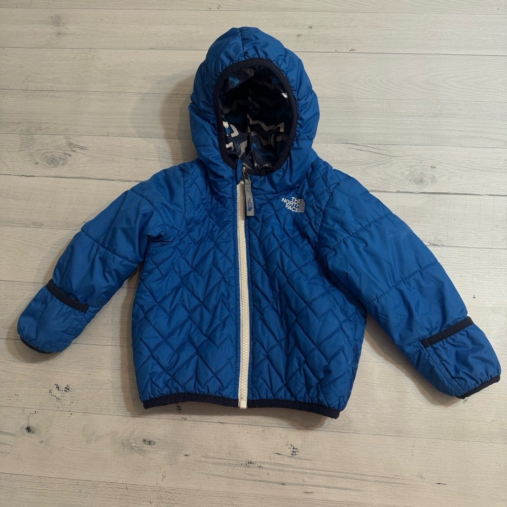 The North Face kids reversible blue puffer jacket